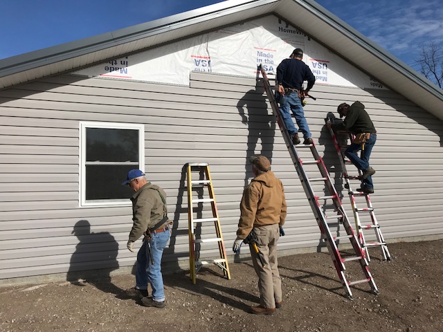 Our siding crew finishing up the house